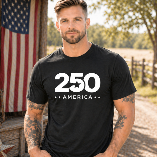 Man wearing a black t-shirt with '250 America' design outdoors.