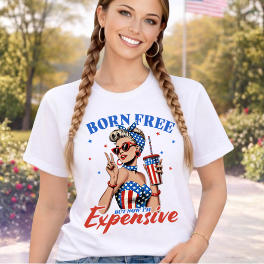 Woman wearing a white "Born Free but now Im expensive Tshirt.