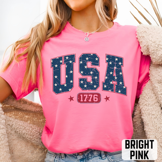 Bright pink USA 1776 T-shirt with navy star lettering and red 1776 banner, bold patriotic shirt for women