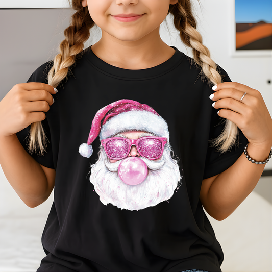Child holding black T-shirt with glitter-look Santa bubblegum graphic