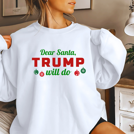 Woman wearing white “Dear Santa, Trump Will Do” Christmas sweatshirt with red and green lettering
