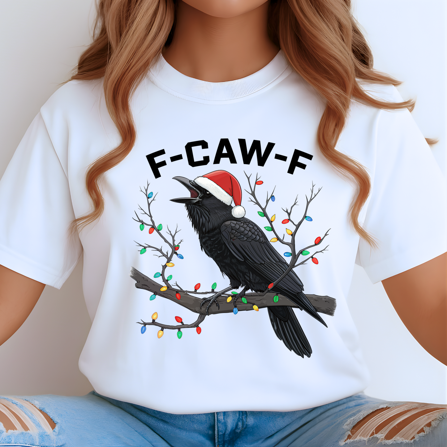 Woman in white funny raven holiday shirt featuring festive lights and Santa hat.