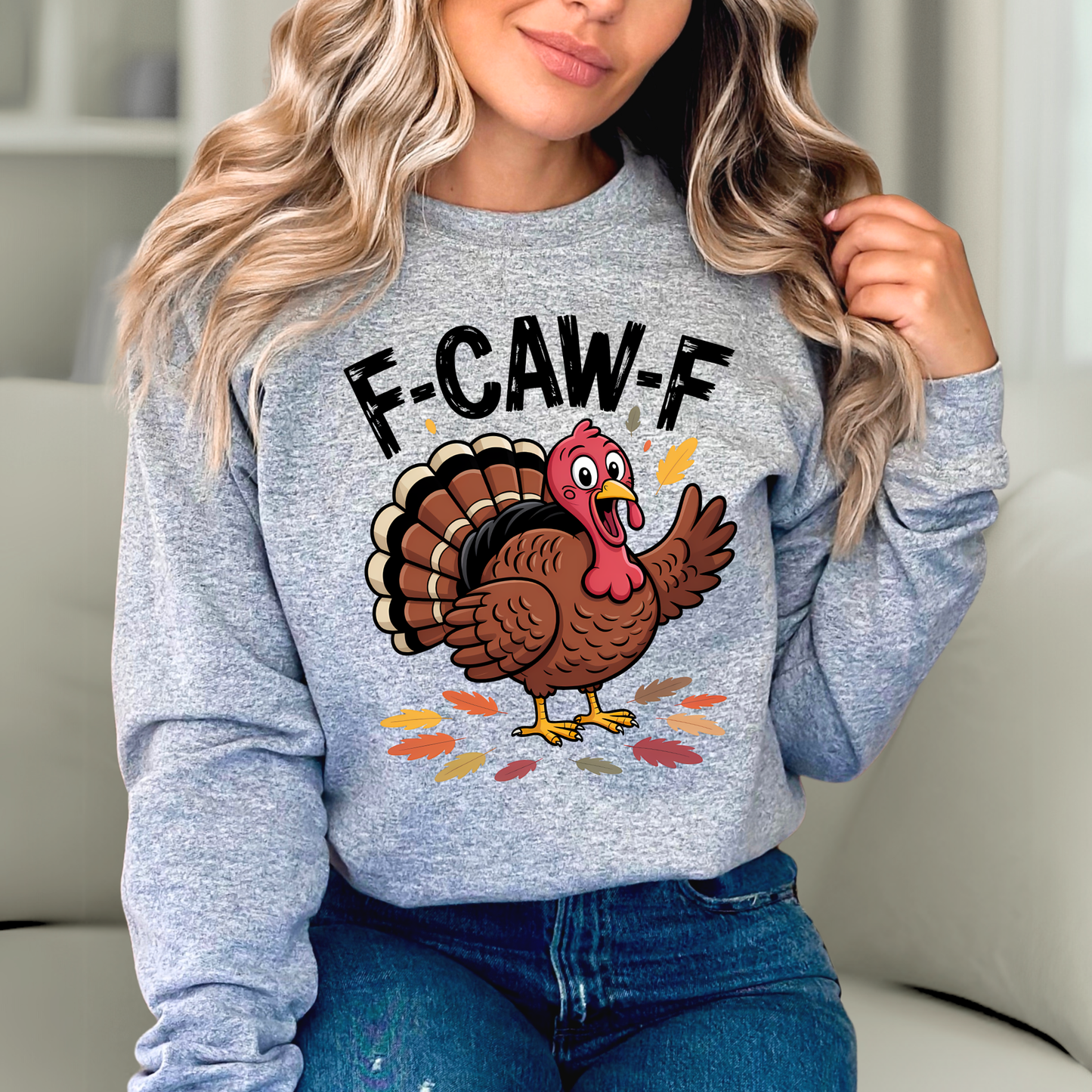 Woman in gray Thanksgiving sweatshirt featuring cartoon turkey print