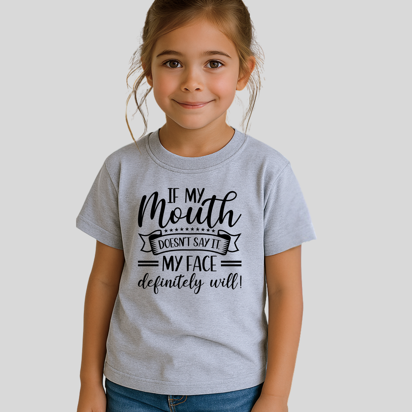 Little girl in gray t-shirt that says “If My Mouth Doesn’t Say It...”