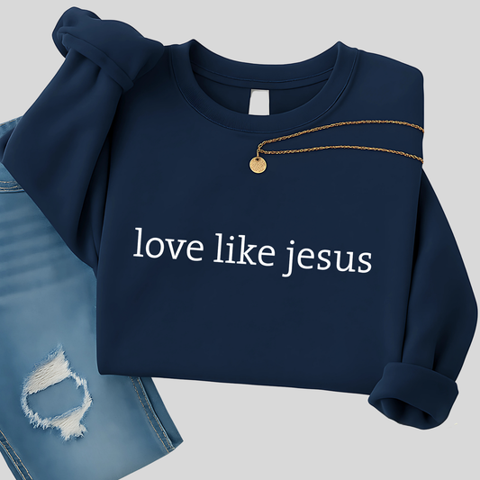 Navy blue sweatshirt with 'love like jesus' text on a light gray background
