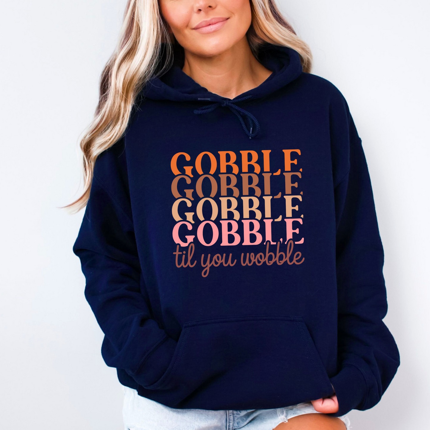 Navy blue hoodie featuring “Gobble Til You Wobble” text – casual autumn loungewear