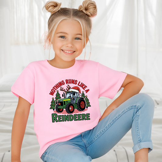 Pink girls Christmas tractor t-shirt featuring festive tractor with Santa hat and trees. Cute holiday farm shirt for little country girls.