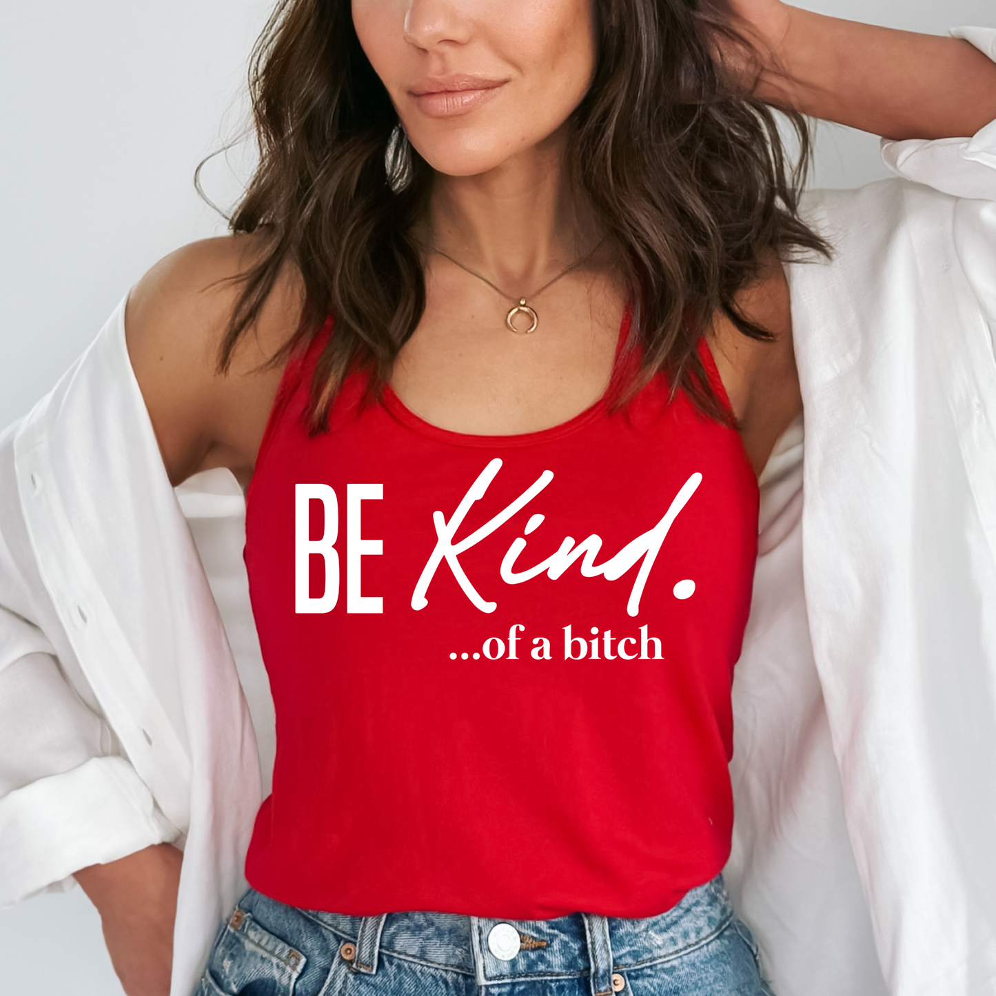red racerback tank with sassy “Be Kind…of a bitch” design worn casually