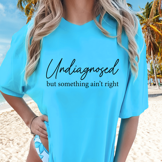 Sky Blue shirt styled with bathing suit, script quote in Black text