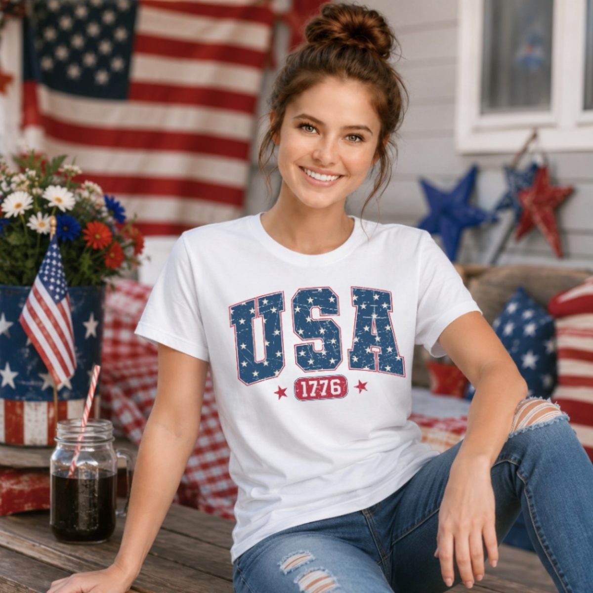A woman wearing a white t-shirt with 'USA 1776' printed in red and blue patriotic lettering.