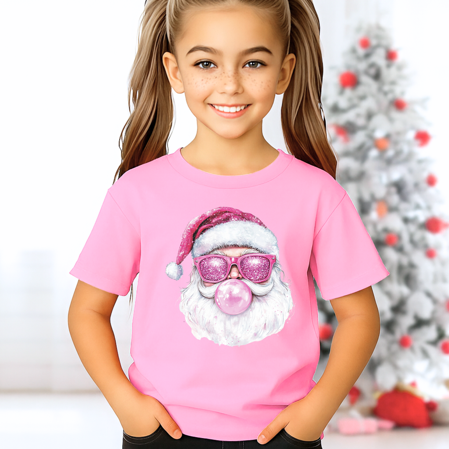 Youth girl wearing bright pink T-shirt with bubblegum Santa printed glitter-look graphic