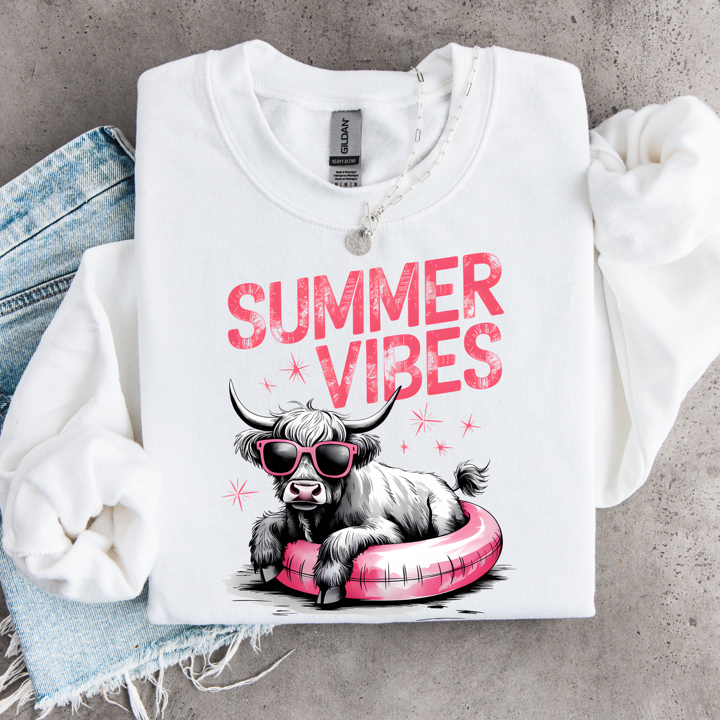 White sweatshirt with 'Summer Vibes' design featuring a cow on a gray background