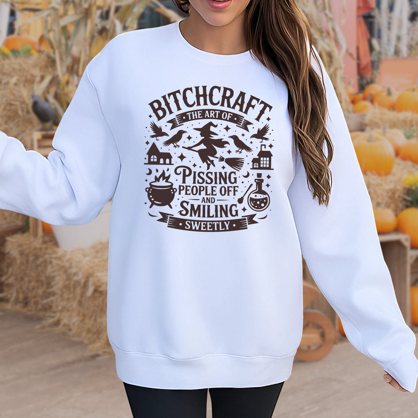 Person wearing a White sweatshirt with funny witchy graphic design