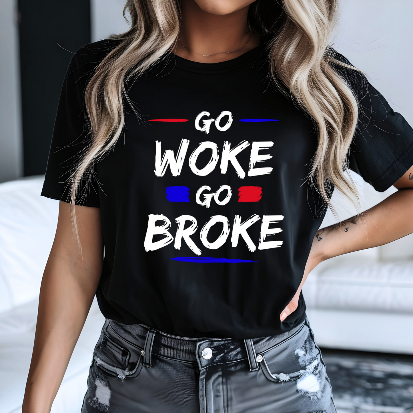 Woman in black “Go Woke Go Broke” graphic tee with distressed jeans