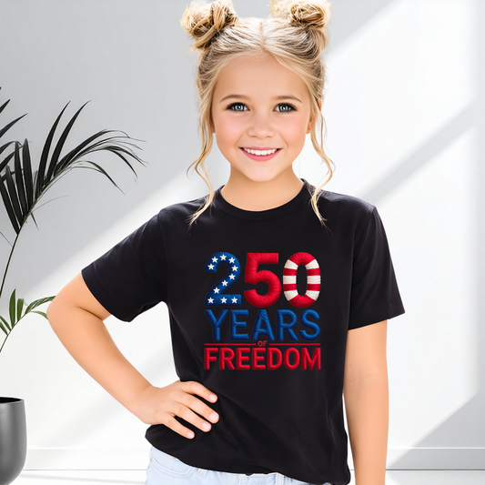 Black youth t-shirt with 250 Years of Freedom patriotic design indoors,