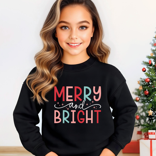 Youth girl wearing black Merry and Bright Christmas sweatshirt