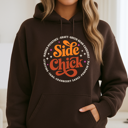 Close-up of a woman in a chocolate brown “Side Chick” hoodie with bold fall typography design. Ideal for Thanksgiving, fall photoshoots, and cozy autumn fashion. Great gift for food lovers and pun fans.
