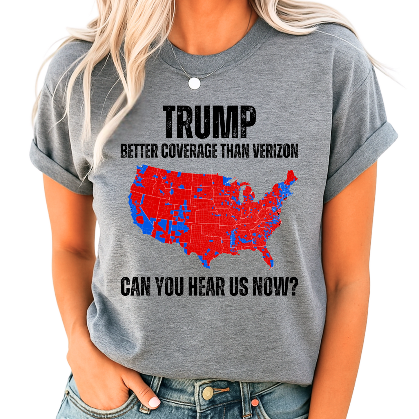 Woman wearing gray patriotic T-shirt with red and blue USA map graphic and bold text design.