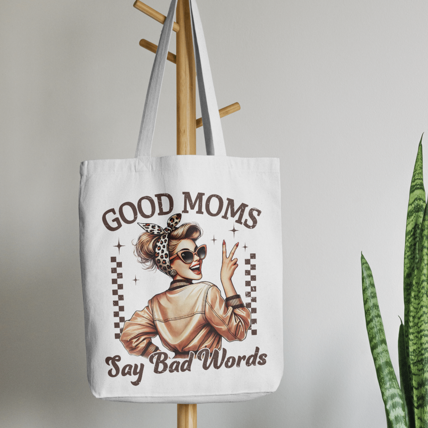 White tote next to scarf and florals – bold gift bag for women