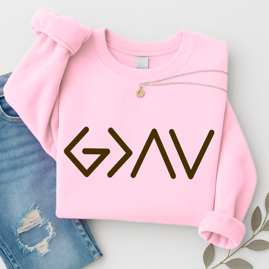 Pink sweatshirt flat lay featuring minimalist gold God Is Greater Than the Highs and Lows front design