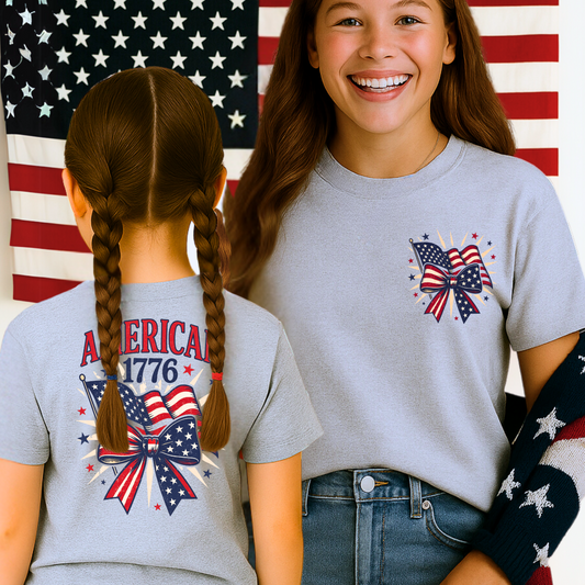 Youth girl wearing sports gray tee with bow and flags – front and back view.
