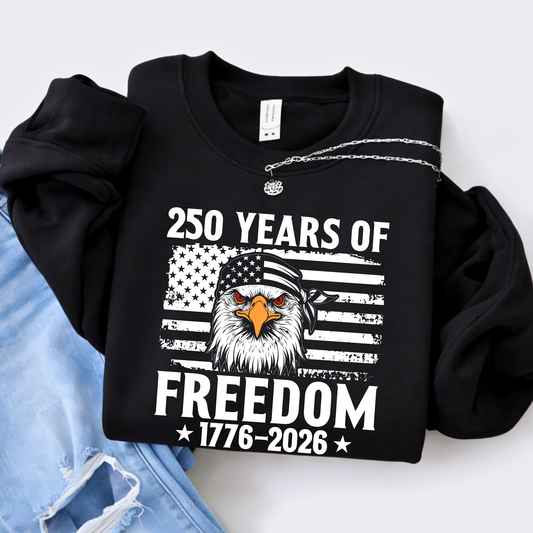 Black sweatshirt with eagle and American flag design celebrating 250 years of freedom, displayed on a white background.