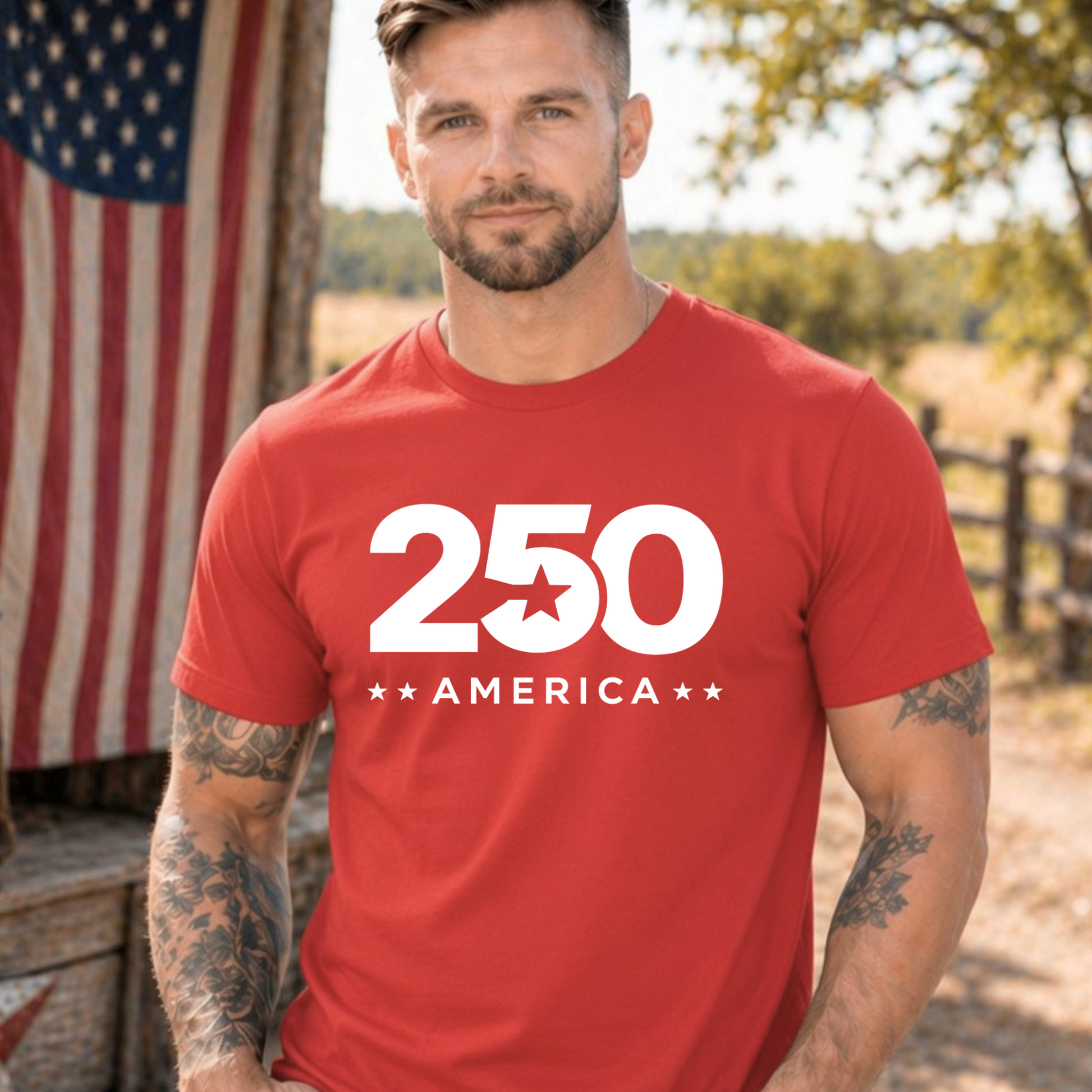 Man wearing a red t-shirt with '250 America' design in front of an American flag.
