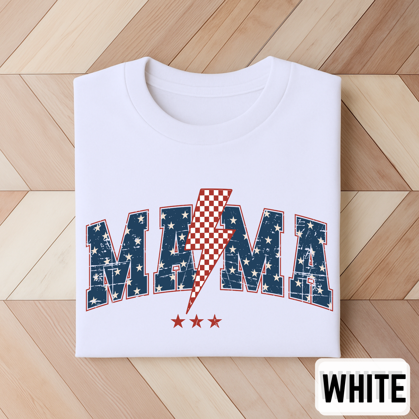 Folded White MAMA USA T-shirt with patriotic stars and red lightning bolt, bold graphic design