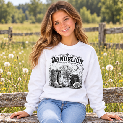 White youth Dandelion crewneck sweatshirt featuring a Bible, cowboy boots, flowers and dandelion graphic.