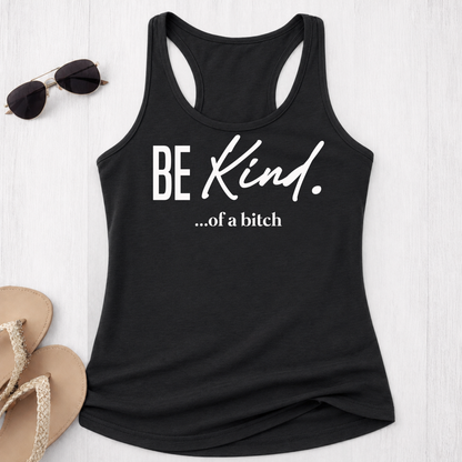 Black tank top with 'BE Kind...of a bitch' text on a white surface with sunglasses and sandals.