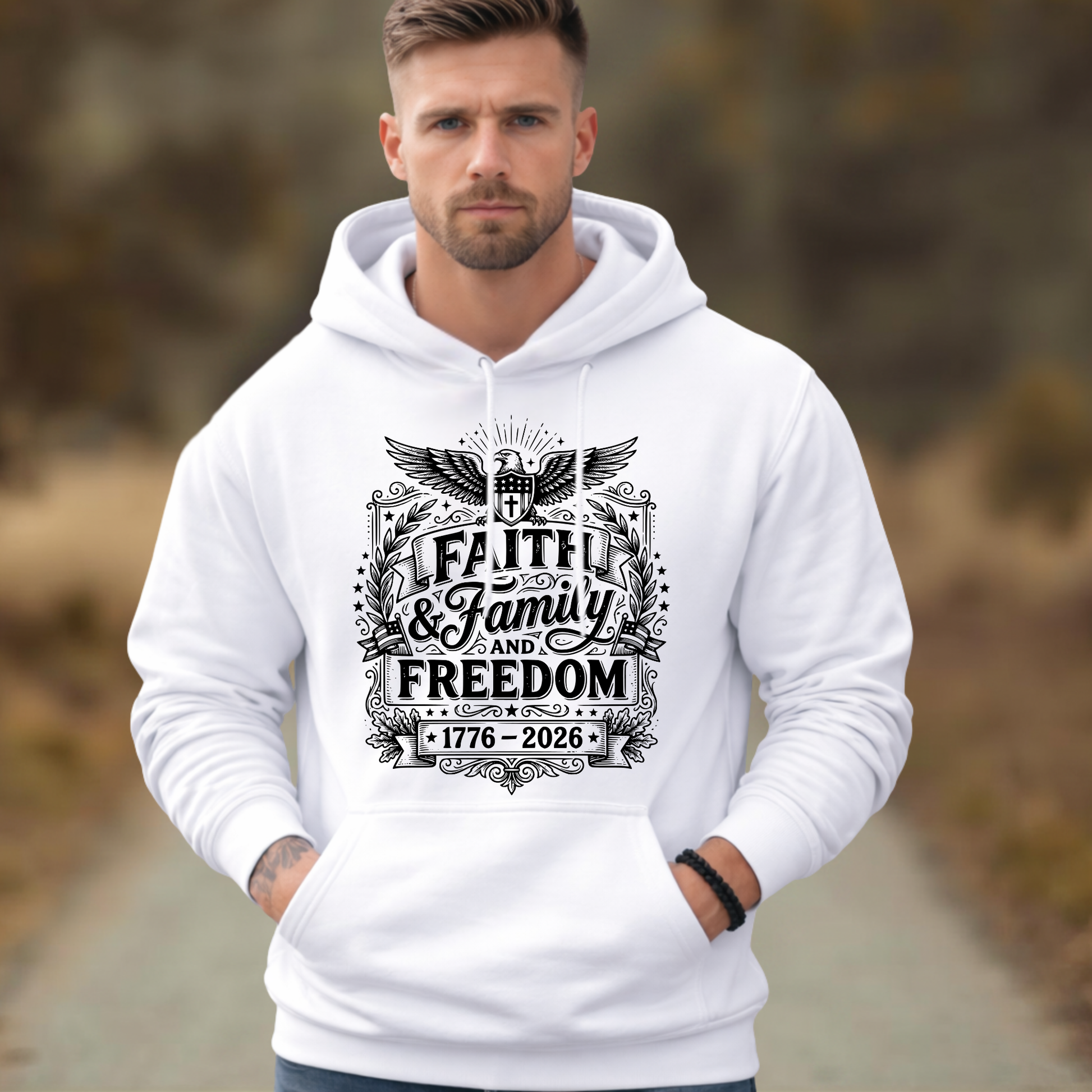 Man wearing a white hoodie with 'Faith & Family Freedom' text and design.