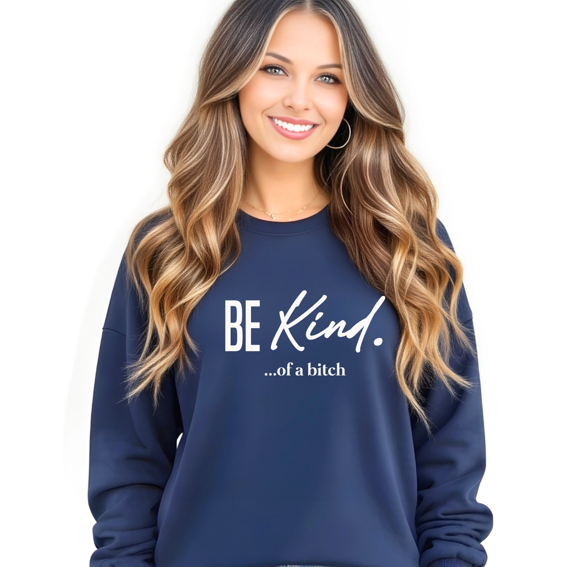 Woman wearing a navy blue sweatshirt with 'BE Kind...of a bitch' text on a white background