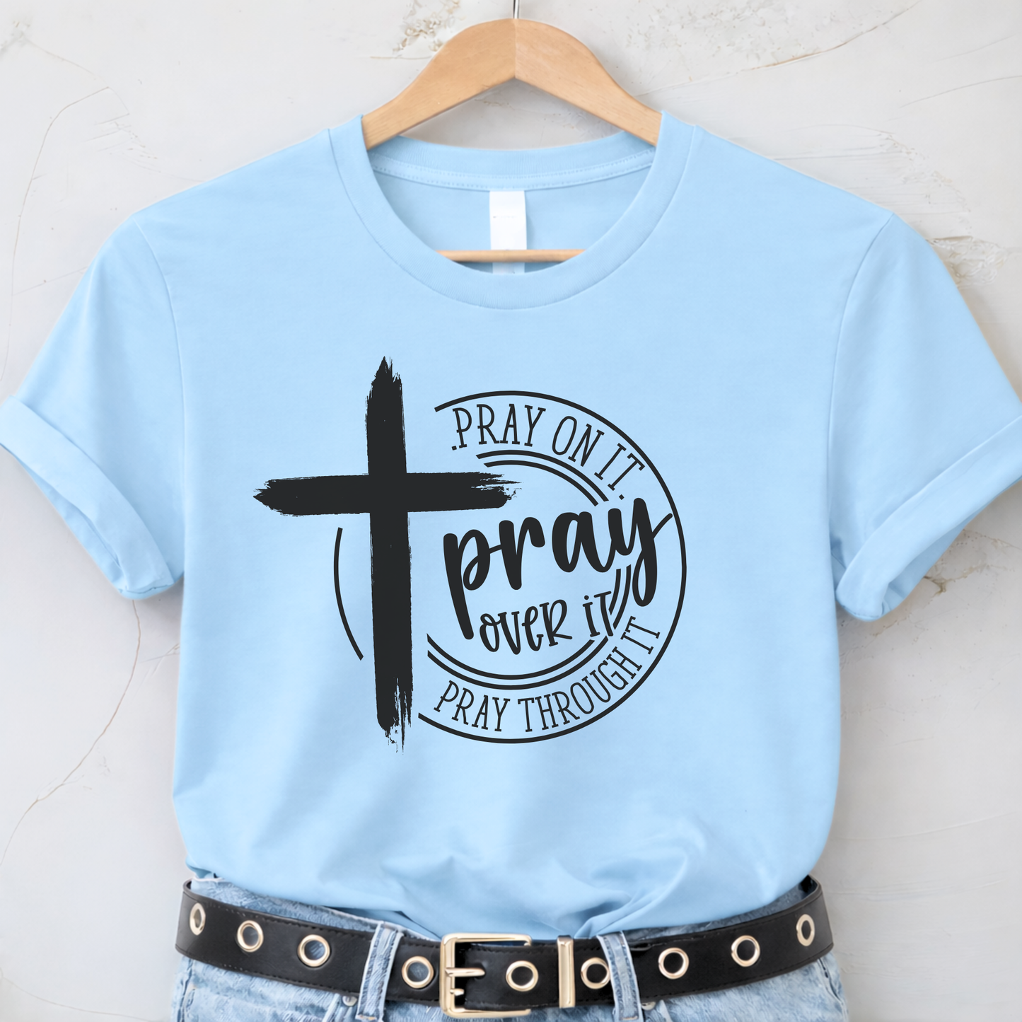 Light blue Pray Over It Christian t-shirt on hanger with prayer message
