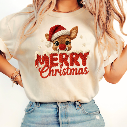 Sand beige T-shirt with faux crochet Merry Christmas reindeer design worn by woman with denim shorts