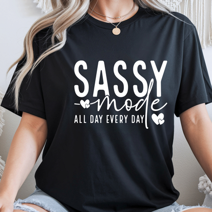 Woman wearing a black t-shirt with 'Sassy mode all day every day' text.