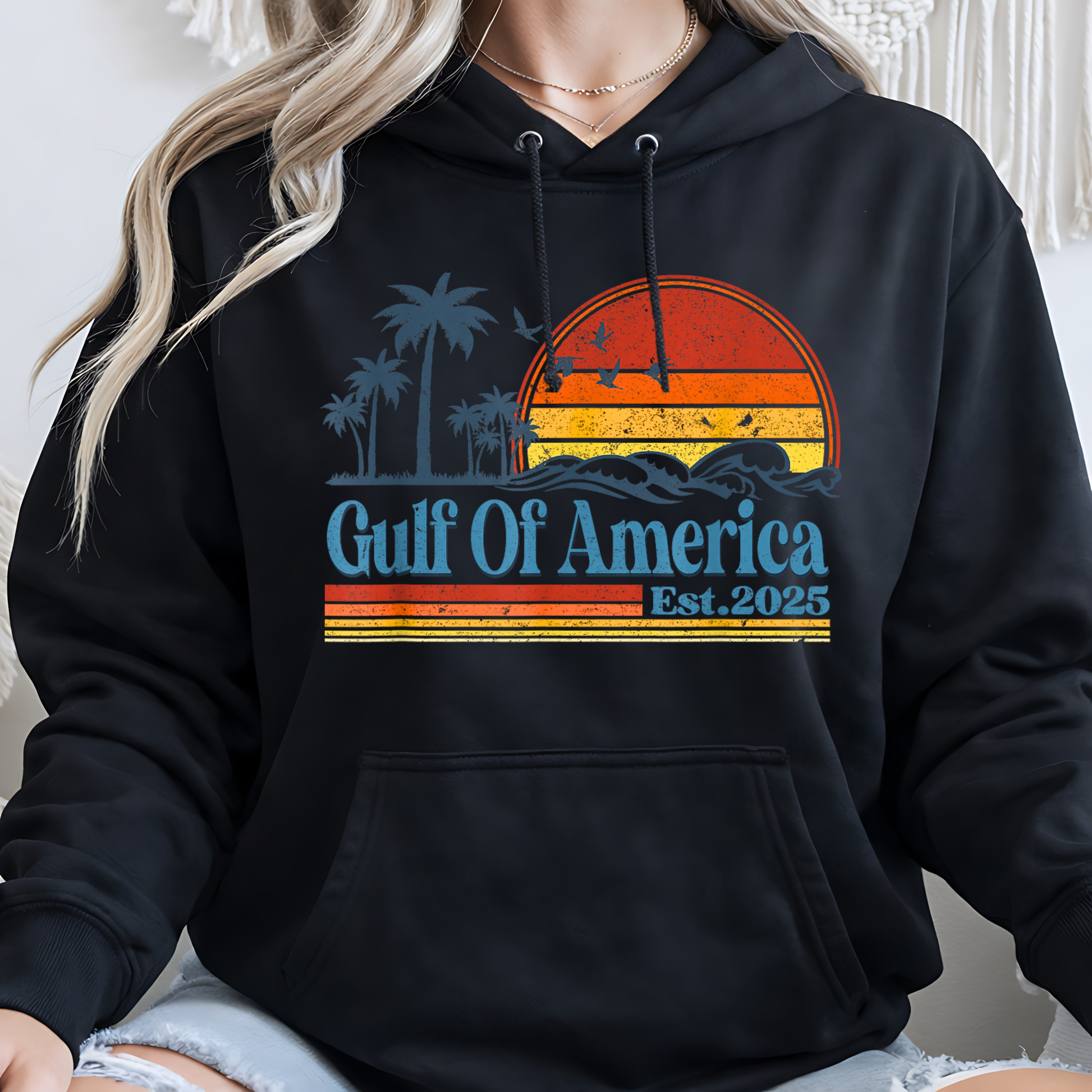 Black hoodie with 'Gulf Of America Est 2025' design on a plain background