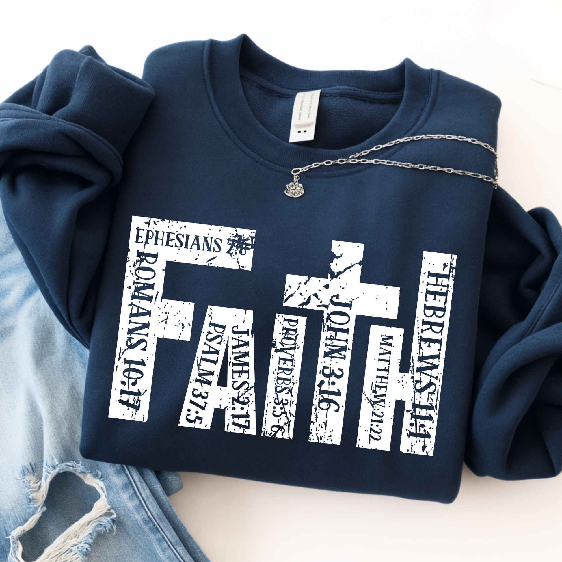 Navy blue unisex Christian sweatshirt flat lay with faith scripture cross design