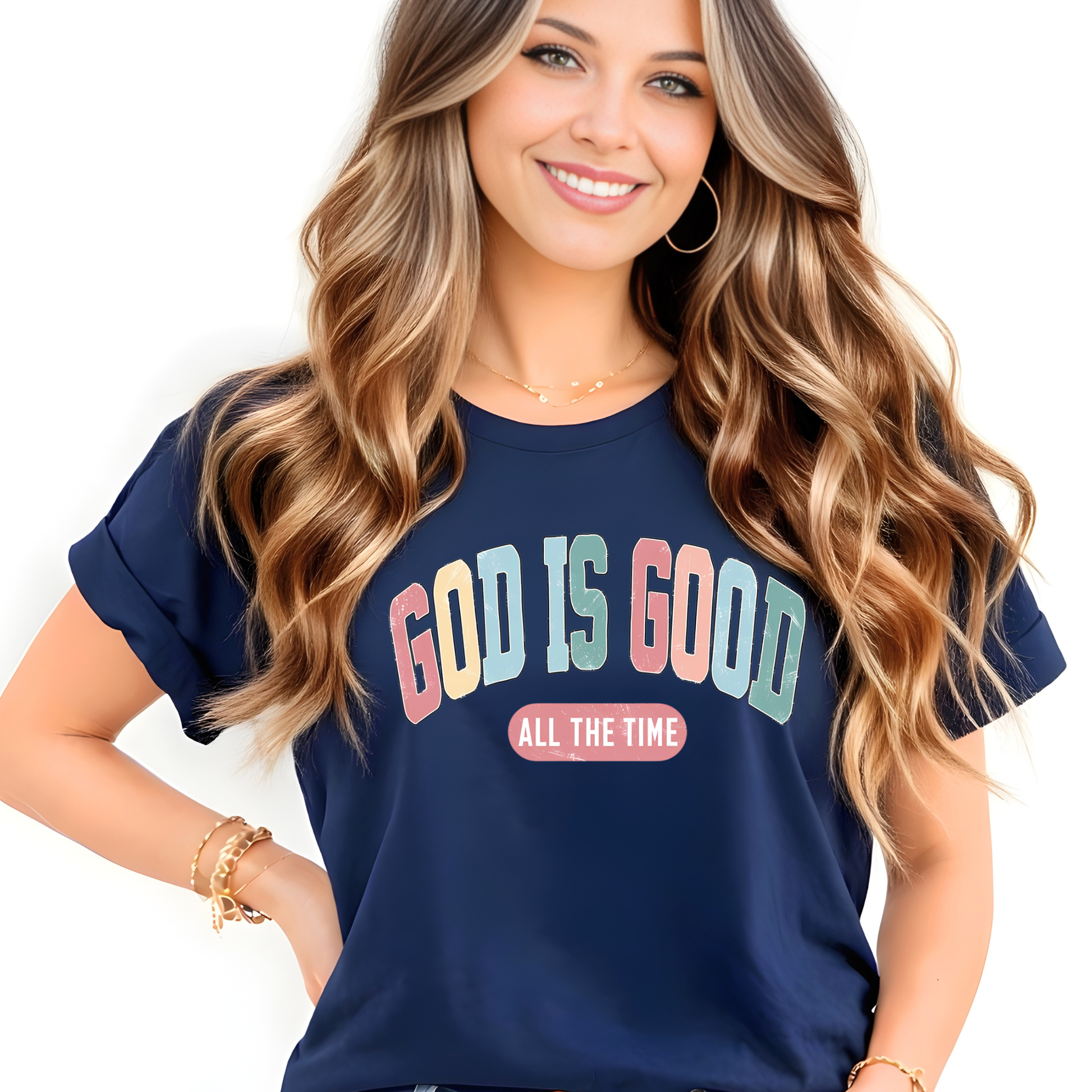 Woman wearing a navy blue t-shirt with 'GOD IS GOOD ALL THE TIME' text.