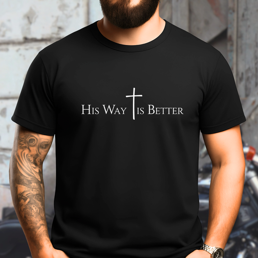 Person wearing a black t-shirt with 'His Way Is Better' text and cross design.