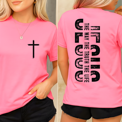 Woman wearing pink Christian t-shirt with small front cross and bold vertical “Jesus The Way The Truth The Life” back design
