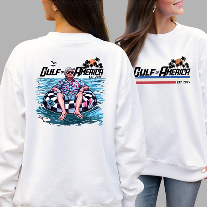White sweatshirt with Donald Trump on a raft and 'Gulf of America' design on front and back, worn by a woman.