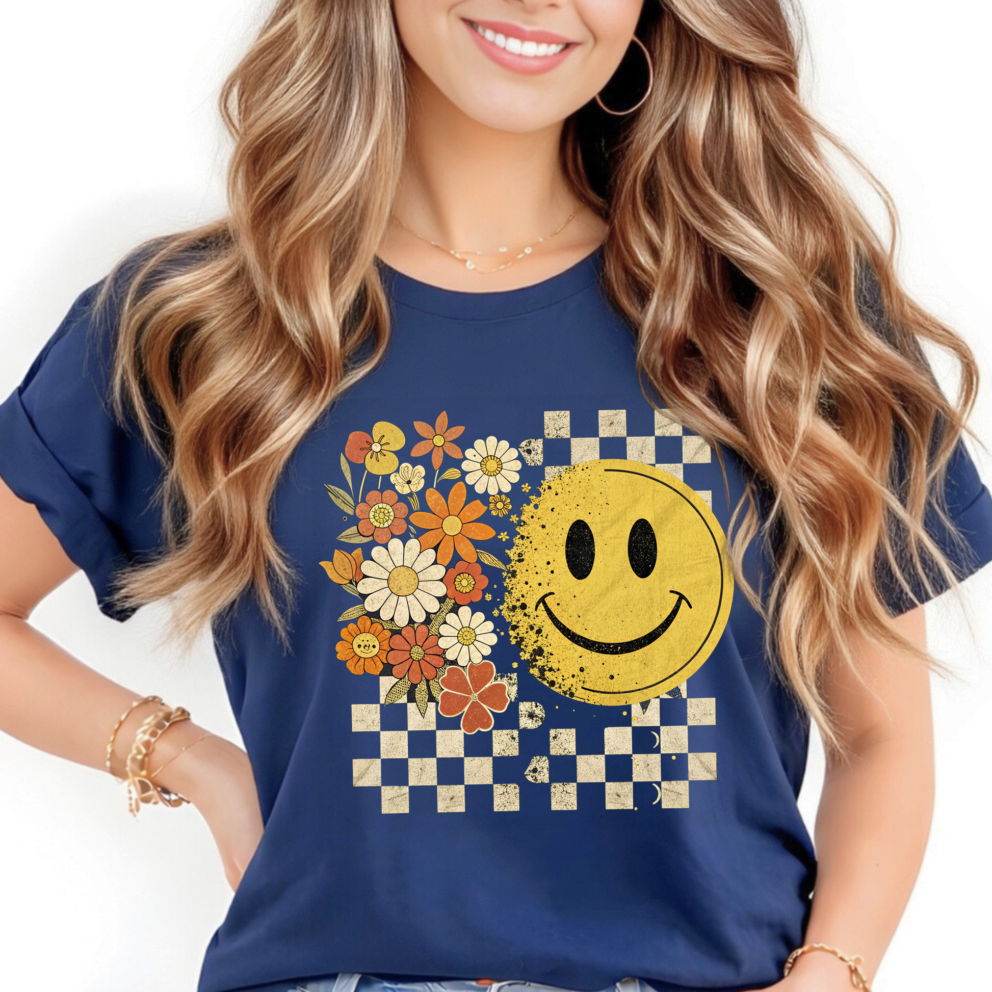 Woman wearing a blue t-shirt with a smiley face and floral design on a white background