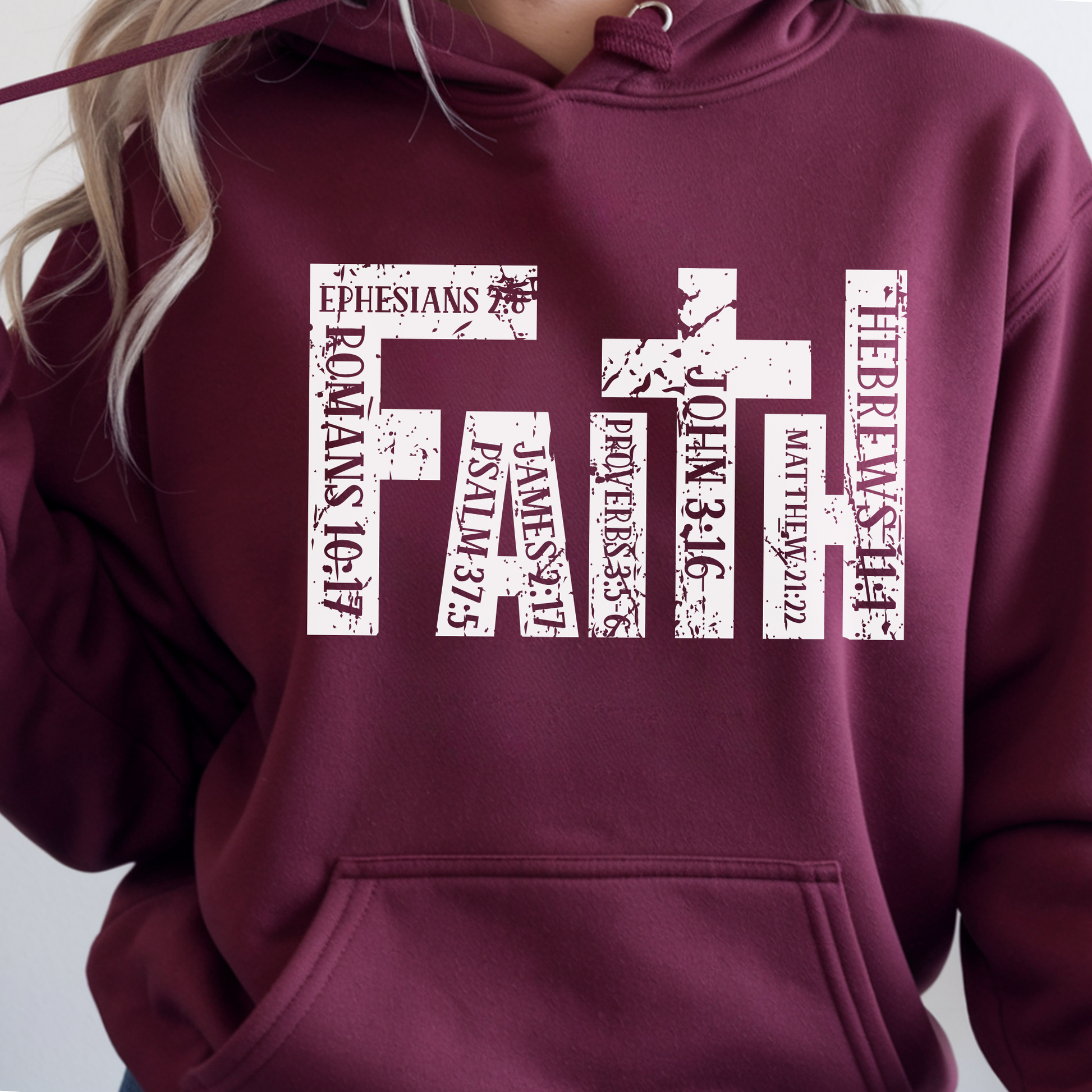 Maroon unisex Christian hoodie close-up featuring faith cross scripture graphic