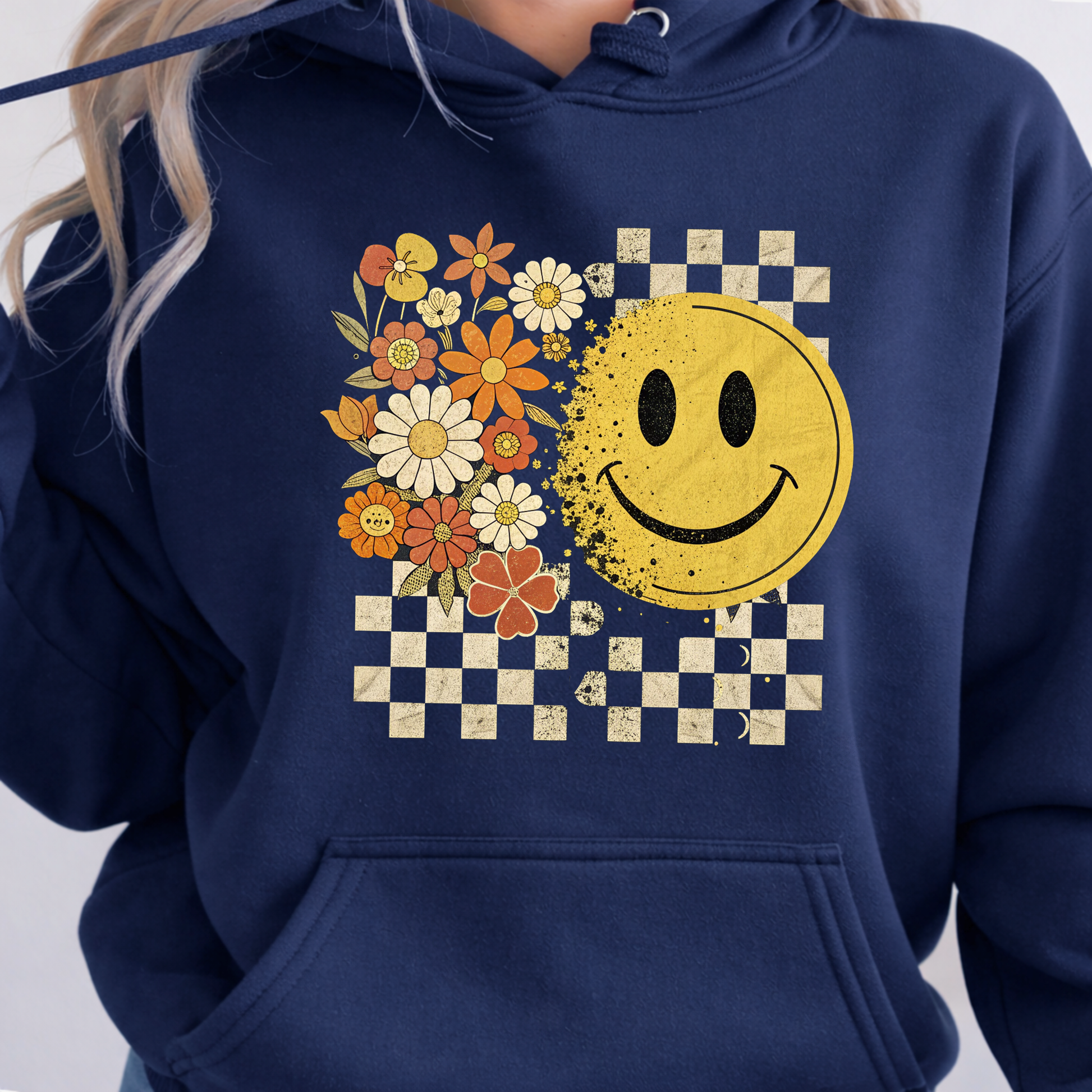Navy blue hoodie with a smiley face and floral design on a white background