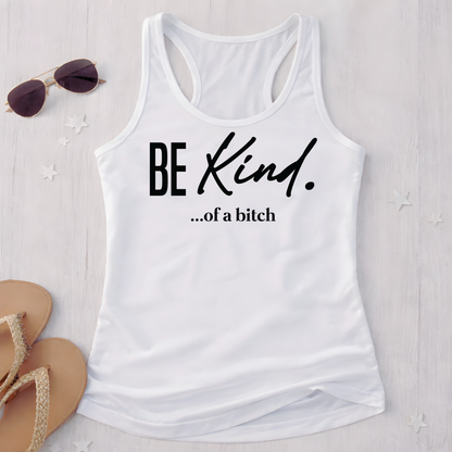 White tank top with 'BE KIND. ...of a bitch' text on a light wooden surface with sunglasses and sandals.