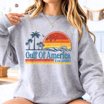 Woman wearing a gray sweatshirt with 'Gulf of America' design