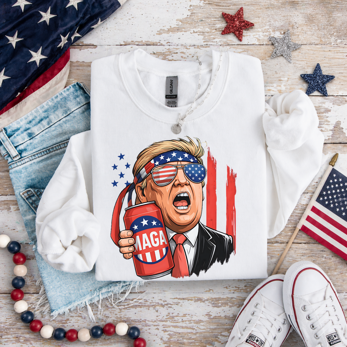 White patriotic beer shirt flat lay with USA themed props