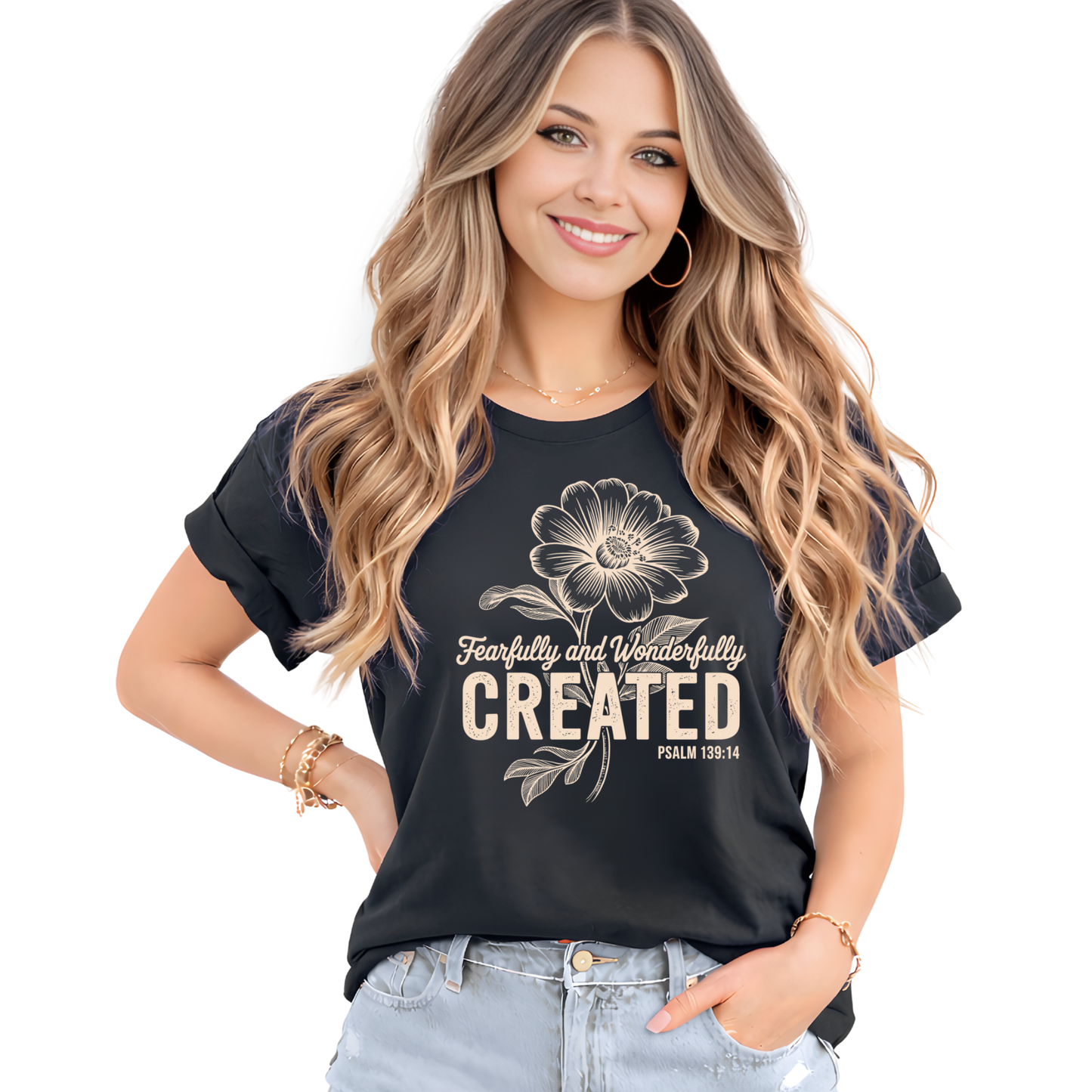 Woman wearing a black t-shirt with a floral design and text on a white background
