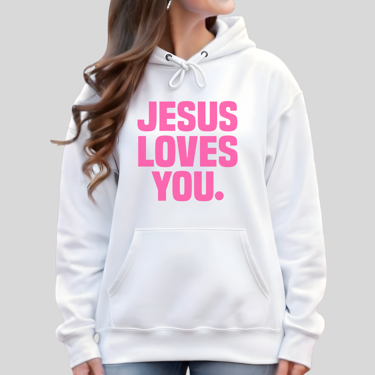 White hoodie with 'Jesus Loves You' text in pink on a plain background