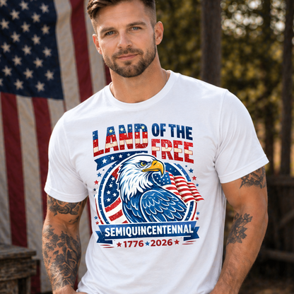 Man wearing a white America 250 t-shirt with an eagle graphic and text in front of an American flag.